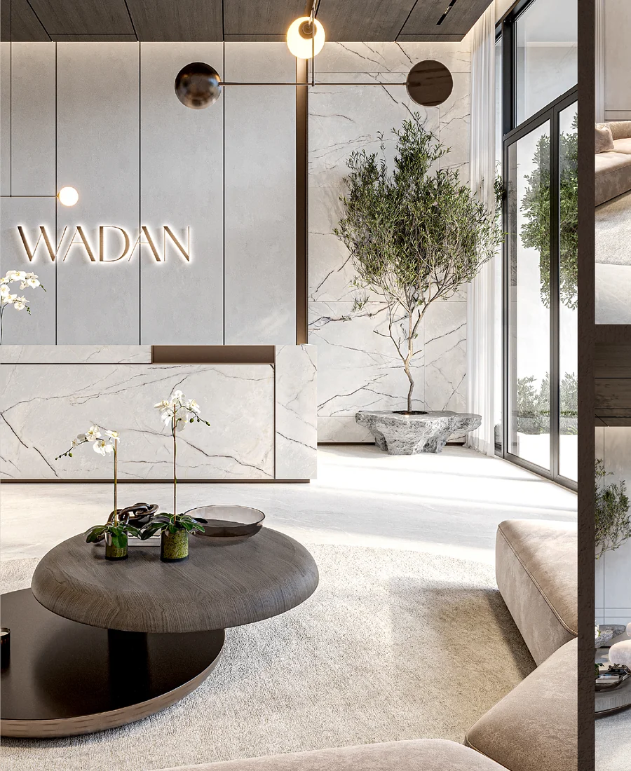 Lobby with a marble reception desk and an olive tree